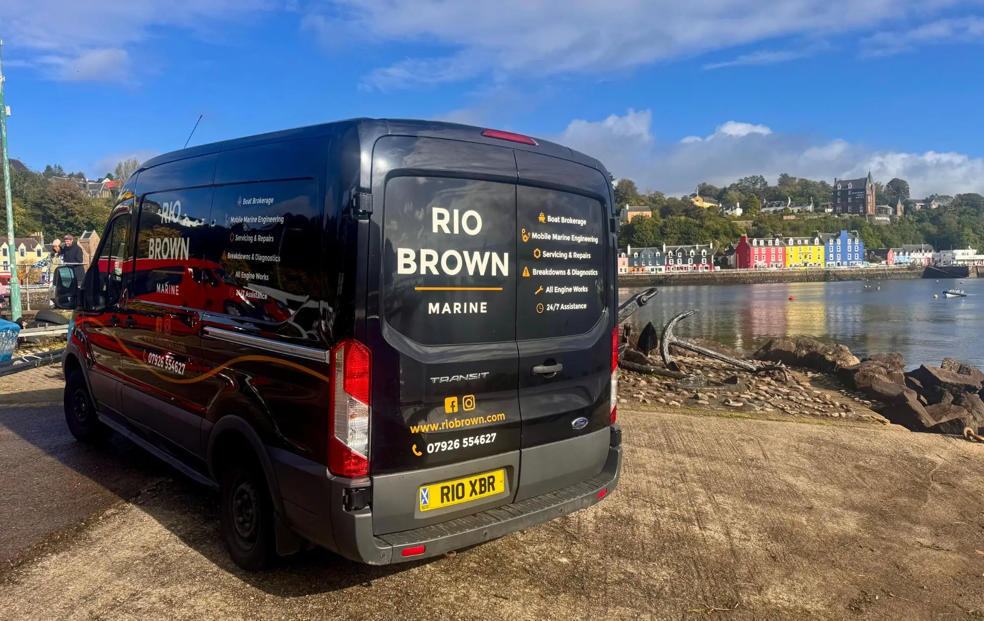 Rear of the Rio Brown Marine van at Tobermory, services listed on the doors